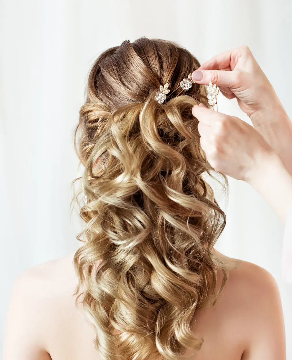 Styling long curly hair with accessories.