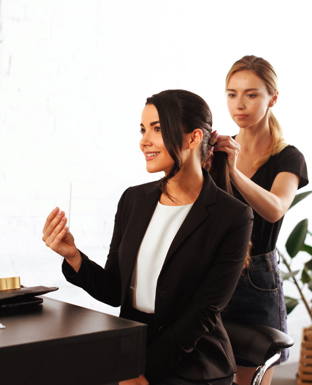 Hairdresser styling woman's hair